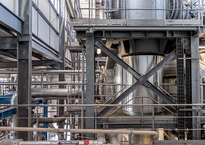 Image of silver tubes in an industrial factory